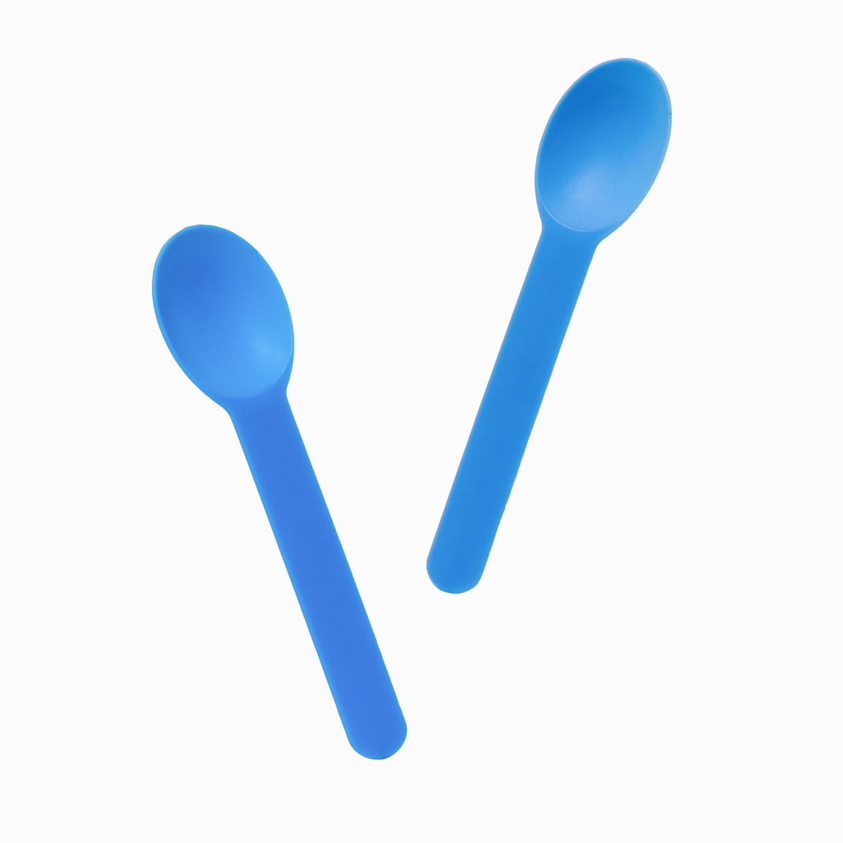 Blue bend-resistant plastic spoons in motion for portioning hard hand-dipped ice cream.