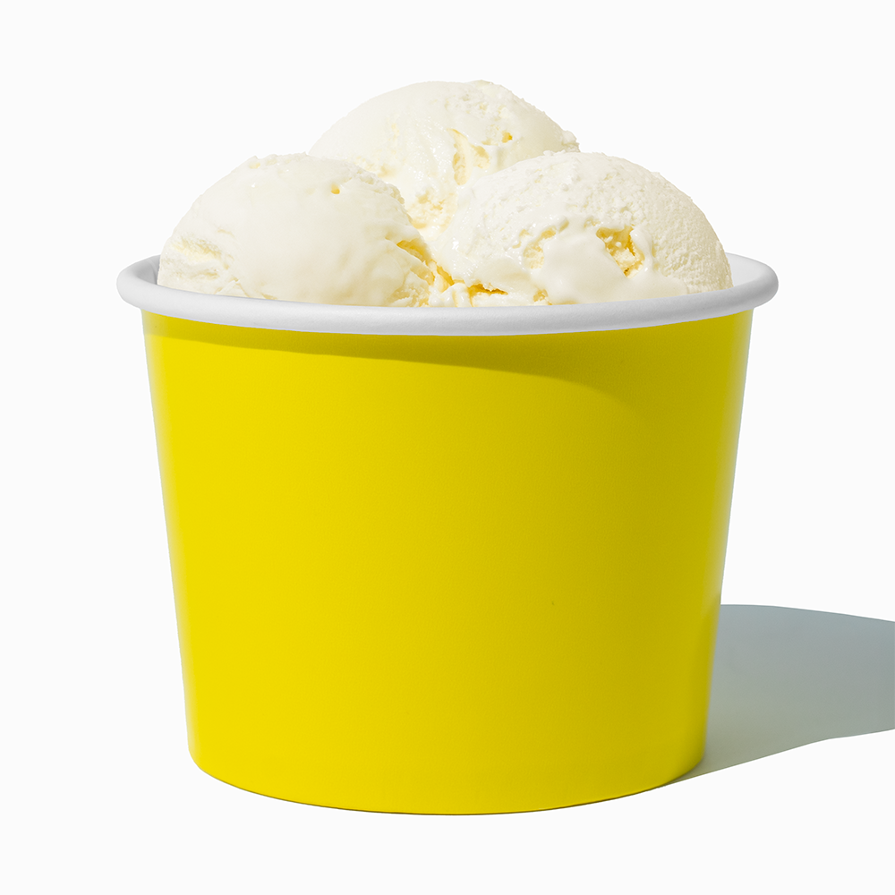 16 oz Yellow paper pint container filled with a family-sized ice cream portion