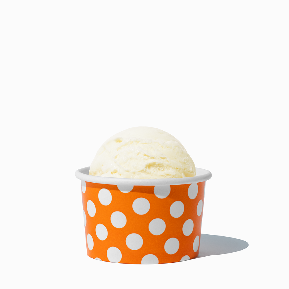 4 oz Orange Polka Dot ice cream cup shown with a fresh scoop of dessert for party catering
