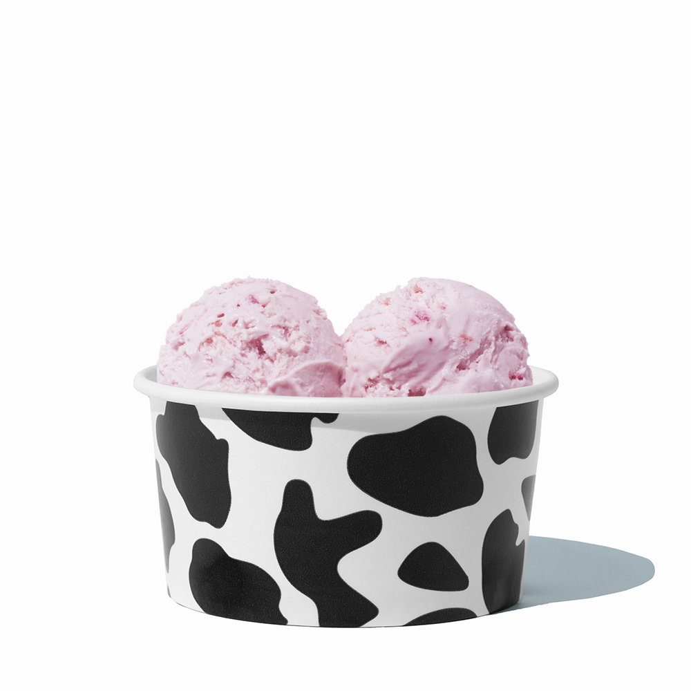 6 oz Cow Print paper ice cream bowl filled with a scoop of ice cream