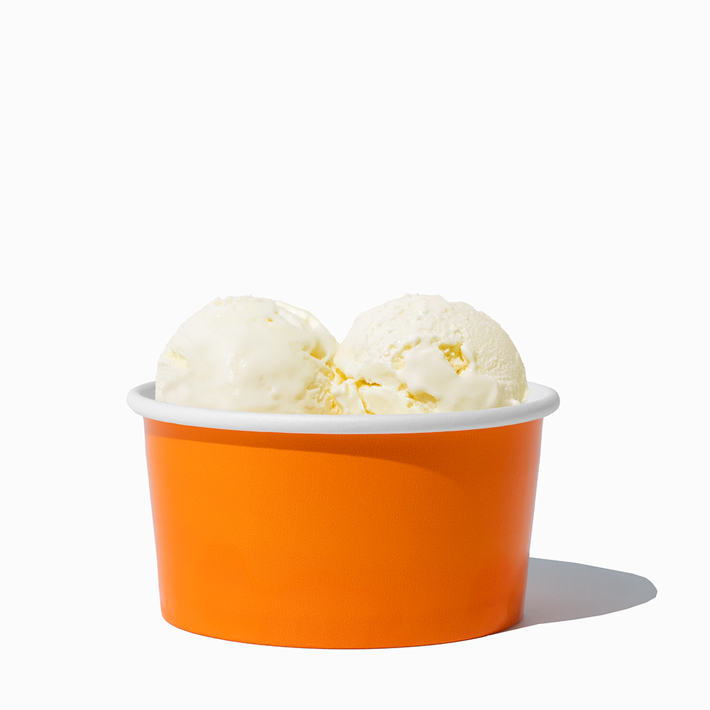 6 oz Orange paper ice cream bowl filled with a scoop of ice cream