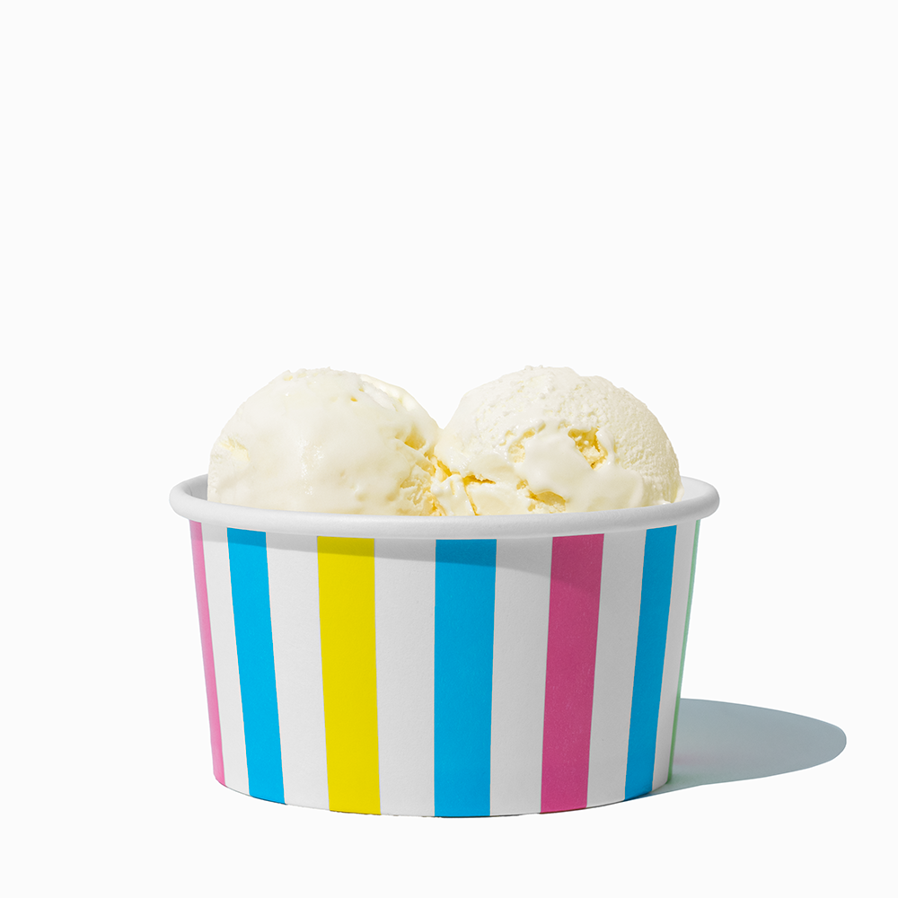 6 oz Rainbow Striped paper ice cream bowl filled with a scoop of ice cream