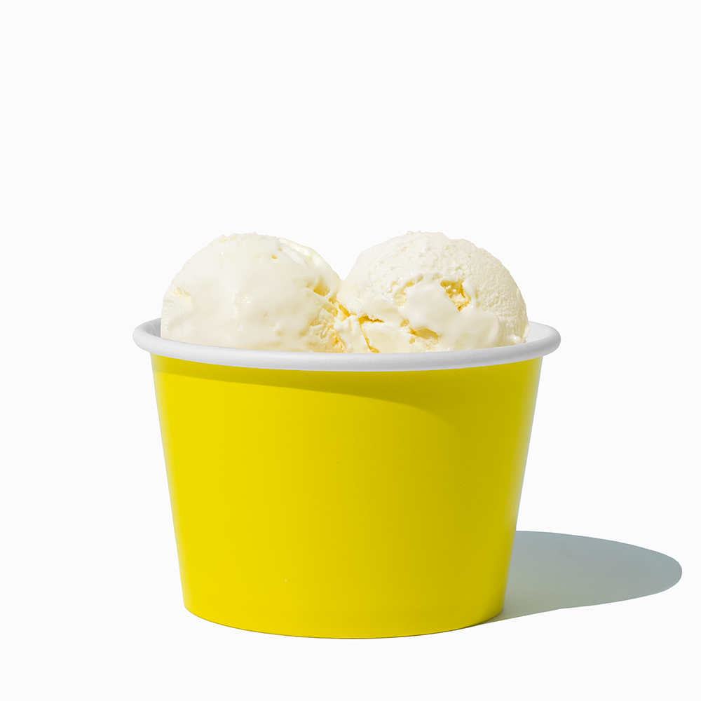 8 oz Yellow bulk ice cream container filled with two scoops of cold treats