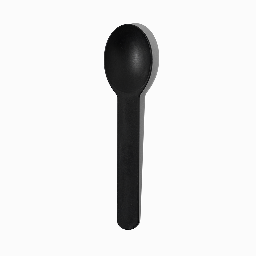 Black heavy-duty commercial plastic ice cream spoon - Single close-up for modern dessert shops.