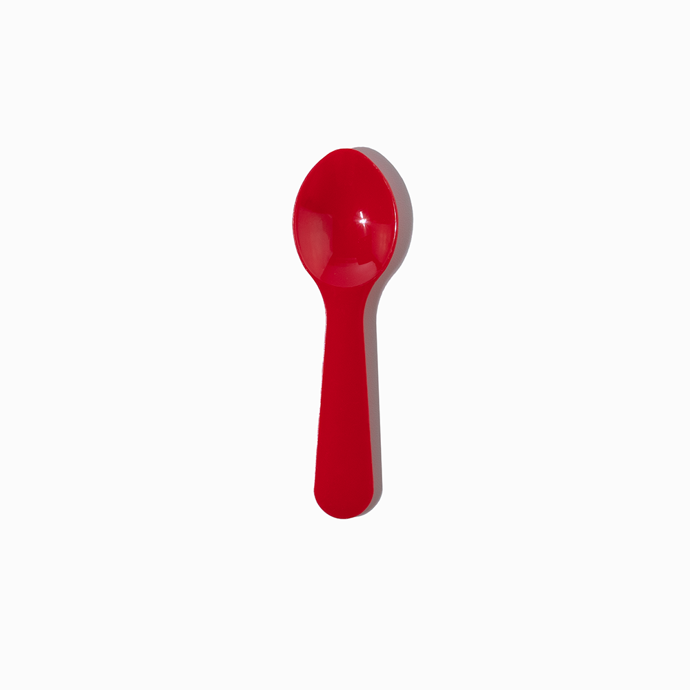 Red 3-inch plastic sample spoon - Single close-up for flavor discovery in dessert shops.