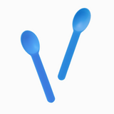 Blue bend-resistant plastic spoons in motion for portioning hard hand-dipped ice cream.