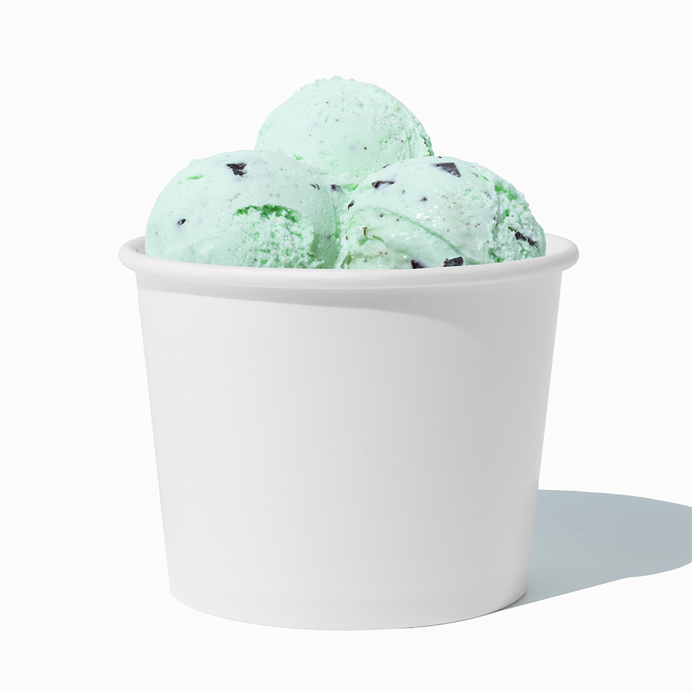 12 oz White paper food bowl shown with a large serving of frozen dessert