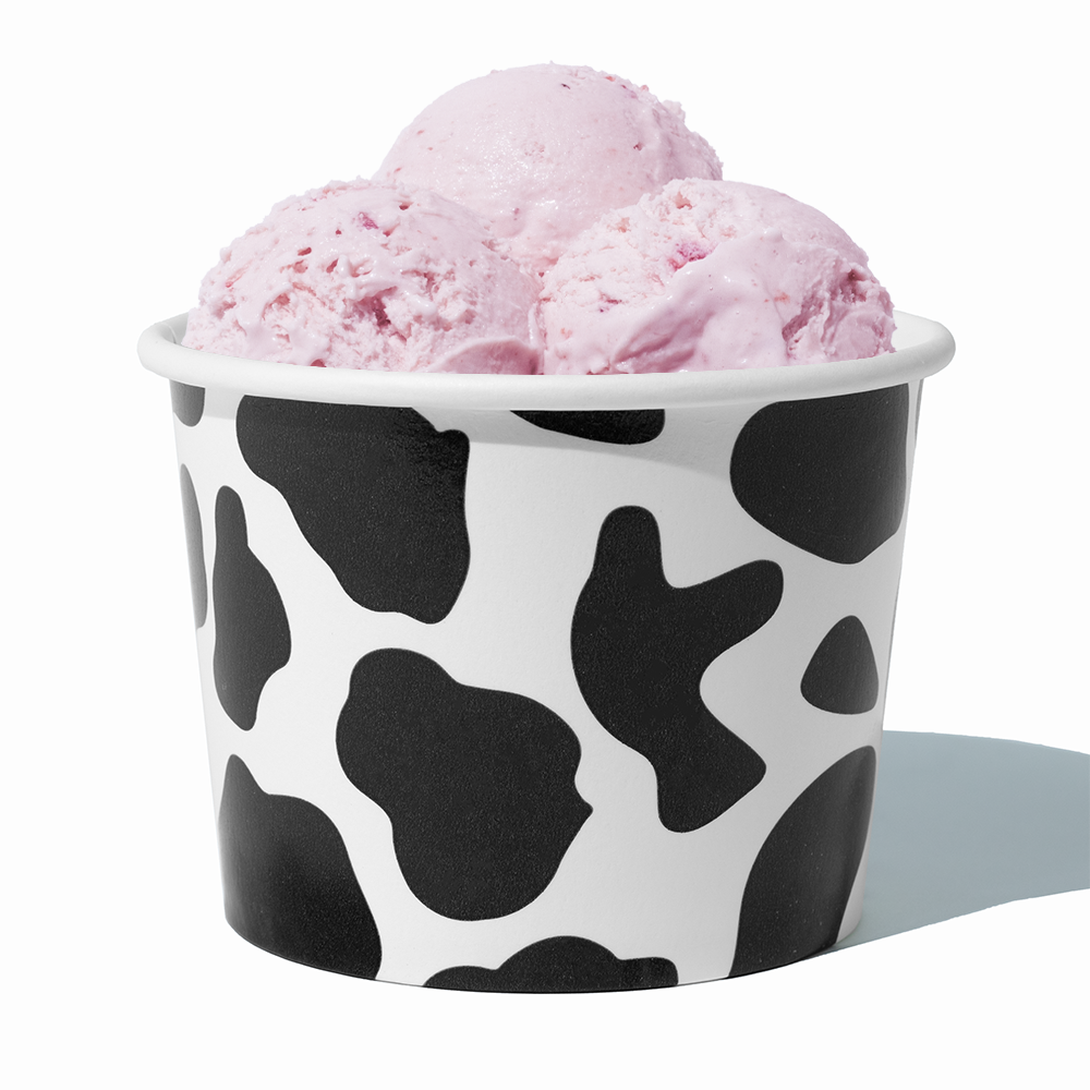 16 oz Cow Print paper pint container filled with a family-sized ice cream portion