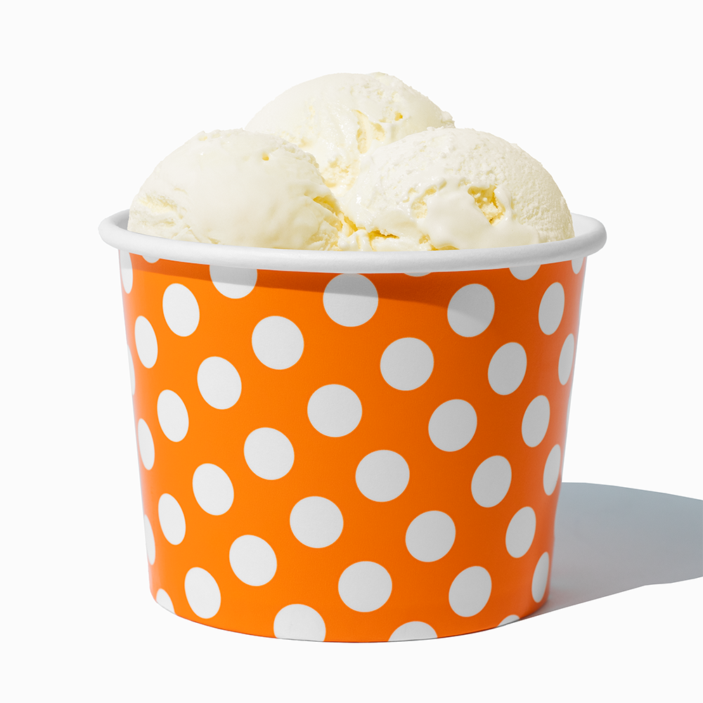16 oz Orange Polka Dot paper pint container filled with a family-sized ice cream portion