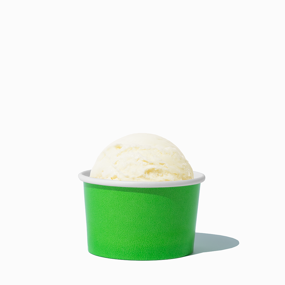 3 oz Green paper cup filled with a mini ice cream scoop for portioned food tasting.