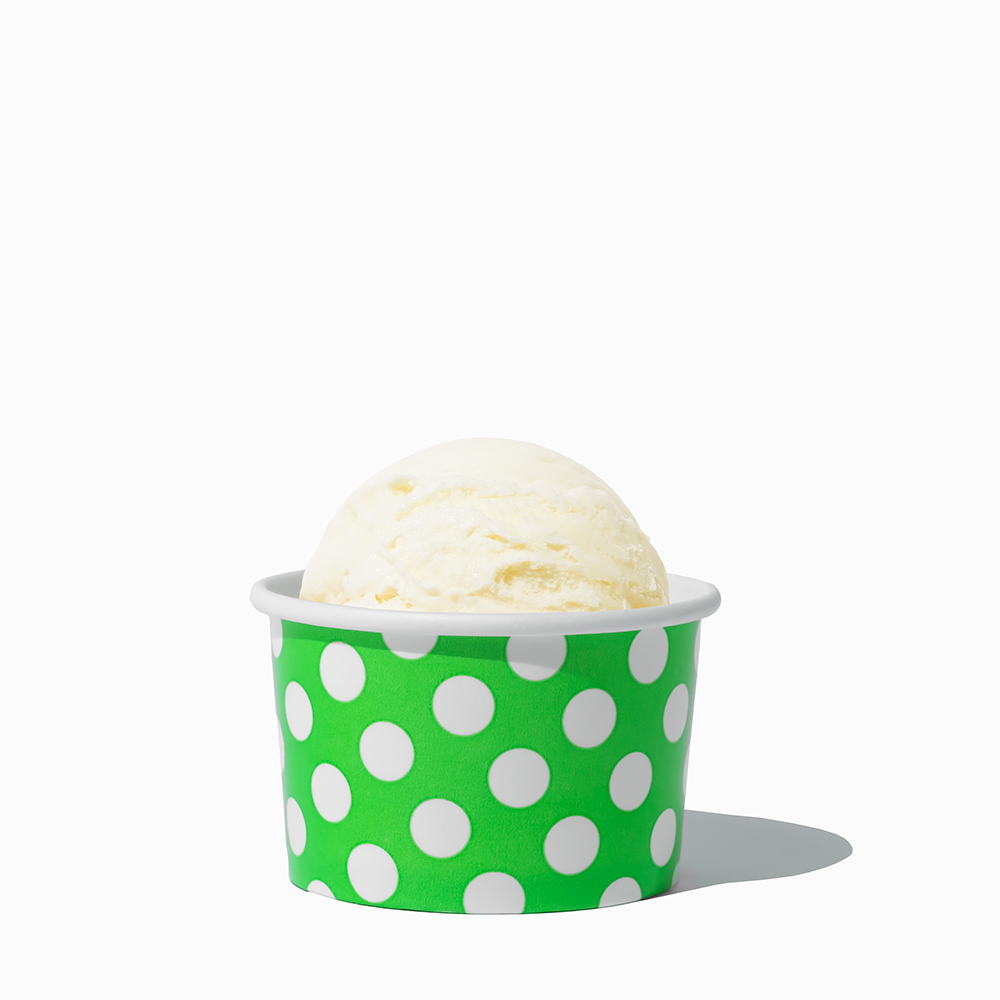 4 oz Green Polka Dot ice cream cup shown with a fresh scoop of dessert for party catering