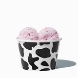 8 oz Cow Print bulk ice cream container filled with two scoops of cold treats