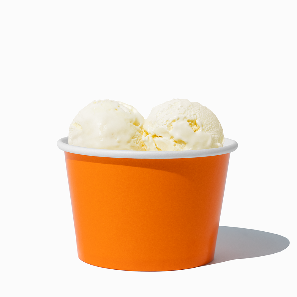 8 oz Orange bulk ice cream container filled with two scoops of cold treats