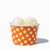 8 oz Orange Polka Dot bulk ice cream container filled with two scoops of cold treats