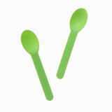 Green strong plastic spoons arranged for serving heavy-weight desserts without snapping.