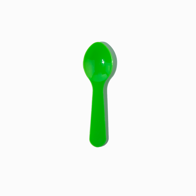 Green 3-inch mini plastic tasting spoon - Single close-up for commercial sample service.