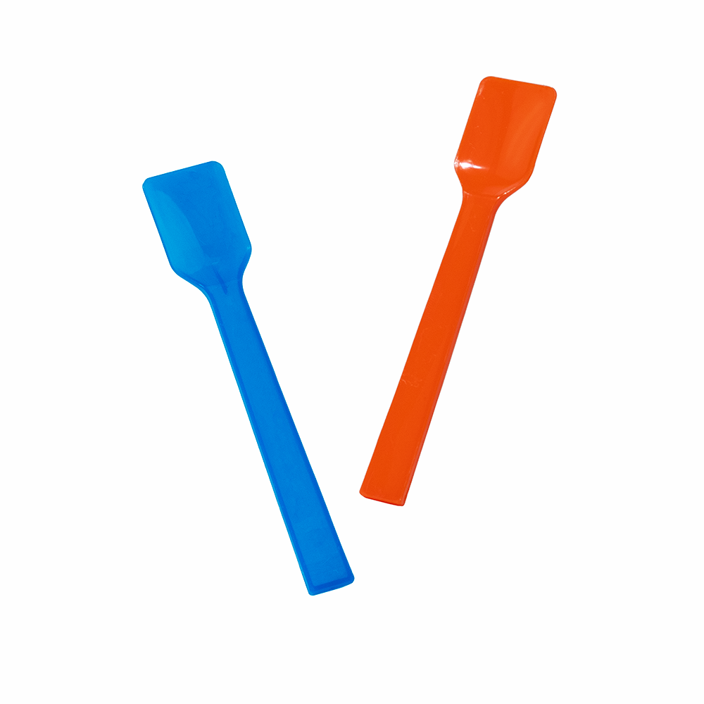Blue and orange plastic gelato spoons crossed in action for vibrant dessert service.