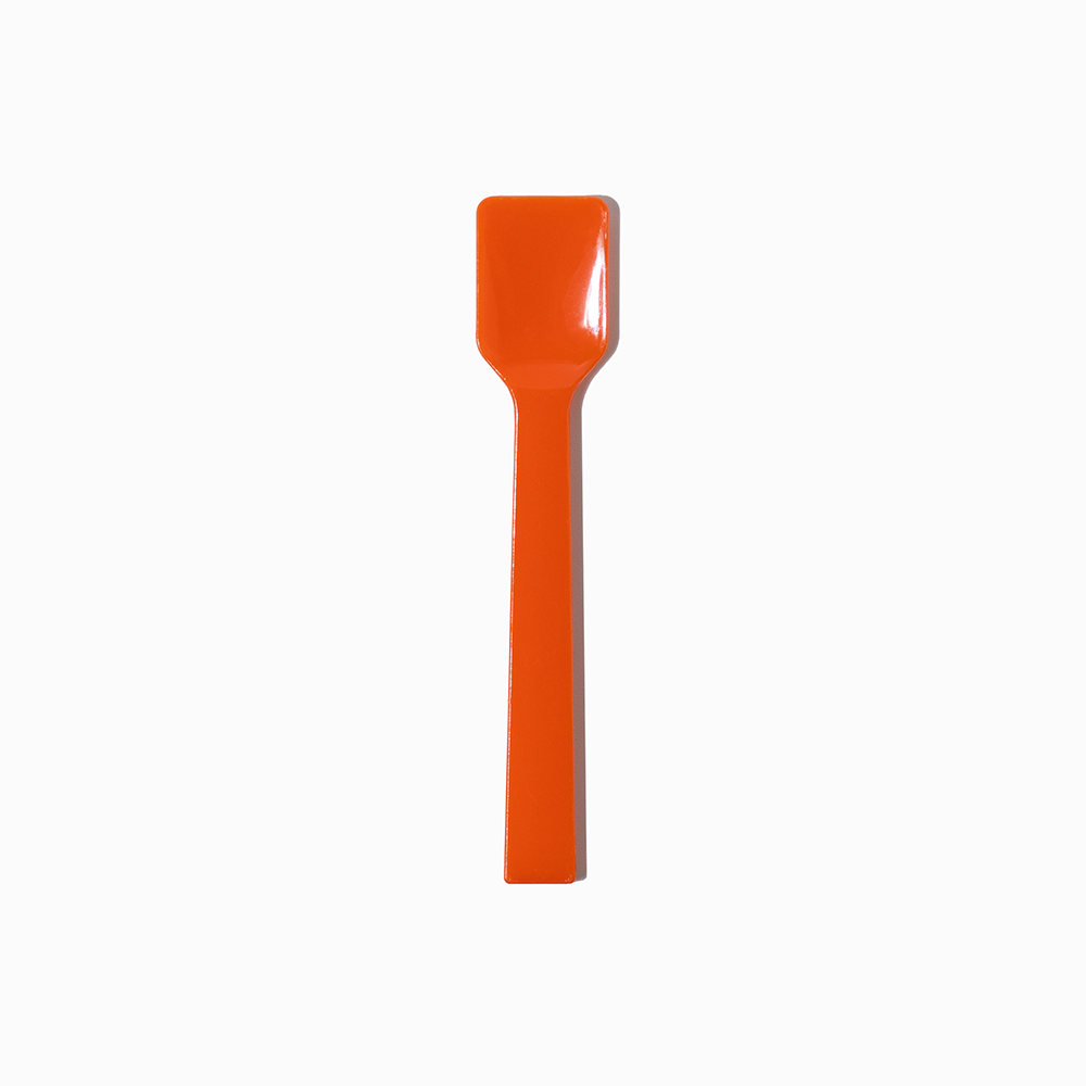 Orange flat-edge plastic gelato spoon - Single close-up for authentic artisanal dessert service.