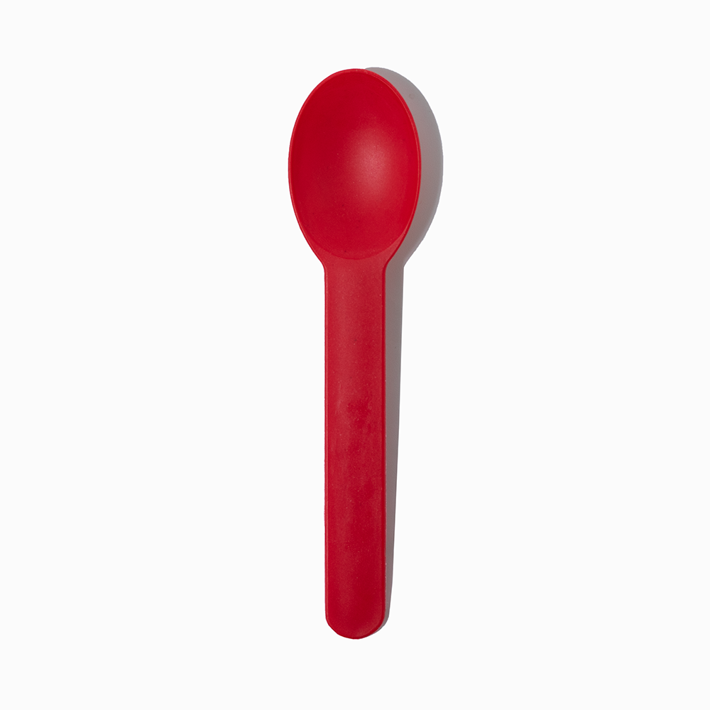 Red heavy-duty plastic dessert spoon - Single close-up for thick milkshakes and sundaes.