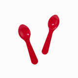 Red mini plastic tasting spoons angled for high-volume commercial catering samples.