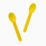 Yellow bend-resistant plastic spoons arranged for high-volume commercial ice cream shops.