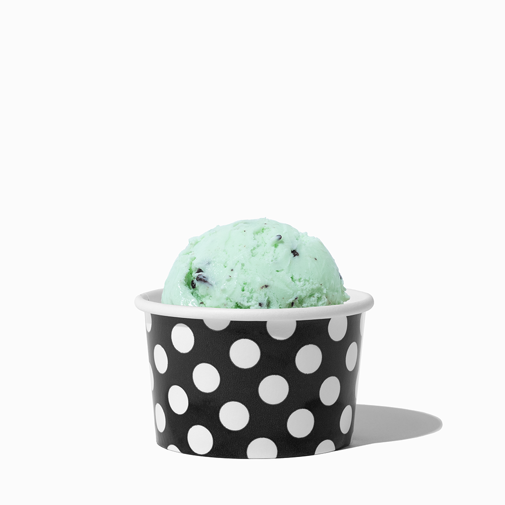 4 oz Black Polka Dot ice cream cup shown with a fresh scoop of dessert for party catering