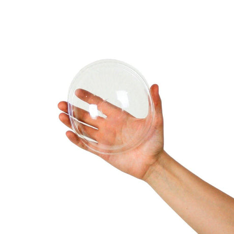 16 oz clear dome lid held in hand for scale